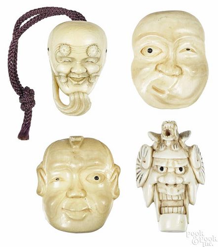 Four Japanese carved ivory mask netsukes