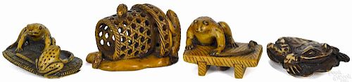 Four Japanese carved wood frog netsukes