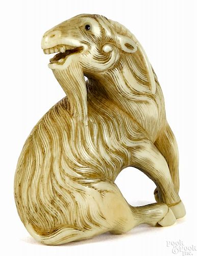 Japanese carved ivory seated goat netsuke, Edo Pe