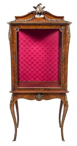 * A Louis XV Style Gilt Metal Mounted Rosewood Vitrine Height 78 3/4 x width 33 1/4 x depth 17 7/8 inches.