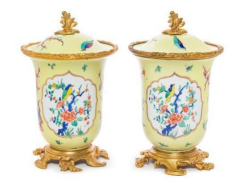* A Pair of French Gilt Bronze Mounted Porcelain Covered Jars Height 8 inches.