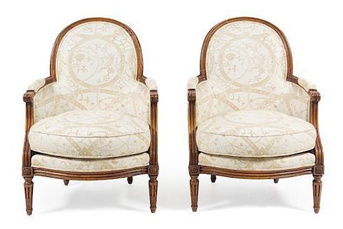 A Pair of Louis XVI Style Oak Bergeres Height 36 1/2 inches.