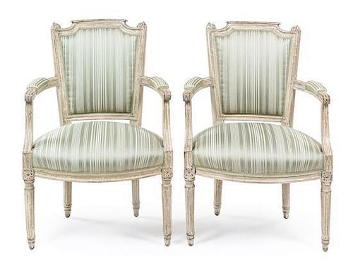 A Near Pair of Louis XVI Painted Fauteuils Height 34 inches.