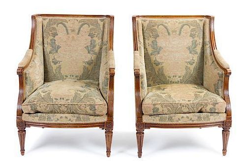 A Pair of Louis XVI Walnut Bergeres Height 36 inches.