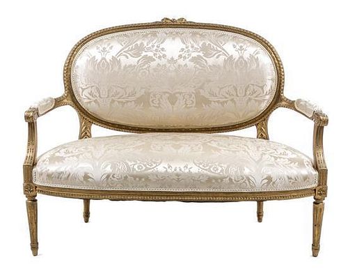 * A Louis XVI Style Giltwood Canape Height 40 1/4 x width 50 1/2 x depth 25 inches.