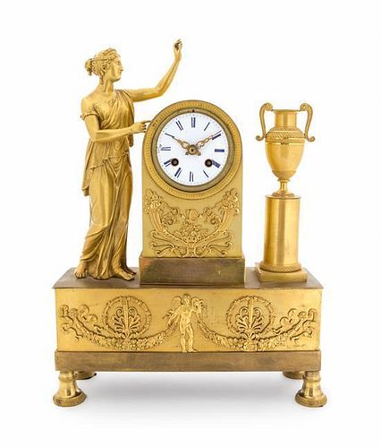 An Empire Gilt Bronze Figural Mantel Clock Height 16 3/8 x width 11 7/8 inches.