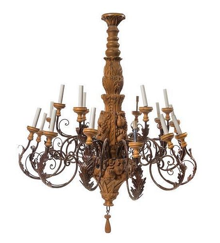 A Carved Wood Twenty-Seven Light Chandelier Height 47 5/8 x diameter 39 inches.