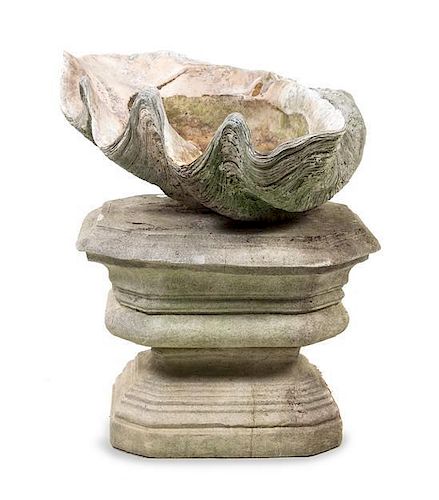 * A Cast Stone Model of a Giant Clam Shell and an Associated Pedestal Height overall 31 3/4 inches.