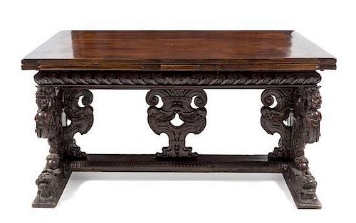 * An Italian Baroque Carved Walnut Refectory Table Height 34 1/4 x width 63 3/4 (closed) x depth 36 1/8 inches.