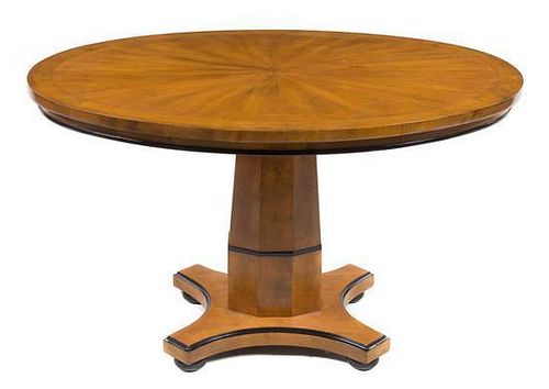 A Biedermeier Style Parcel Ebonized Center Table Height 30 1/2 x width 55 x depth 43 inches.