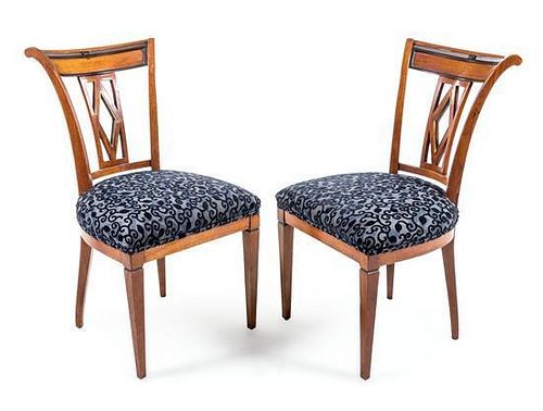 A Pair of Biedermeier Parcel Ebonized Side Chairs Height 34 1/2 inches.