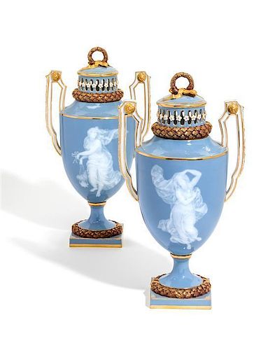 A Pair of Meissen Porcelain Pate-sur-Pate Covered Potpourri Vases Height 12 inches.