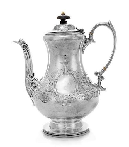 * A Victorian Silver Coffee Pot, Daniel & Charles Houle, London, 1854, the baluster form body chased with floral and foliate 