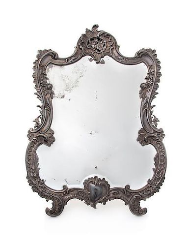 * A French Silver Dressing Mirror, 19th/20th Century, of cartouche form, with an easel.