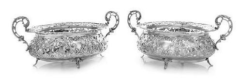 * A Pair of German Silver Bonbon Dishes, , the openwork border and body worked to show rocaille, floral and foliate motifs.