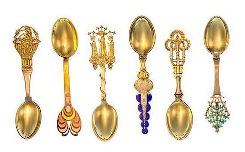 * A Collection of Danish Silver-Gilt and Enamel Christmas Spoons, Anton Michelsen, Copenhagen, comprising examples from the y