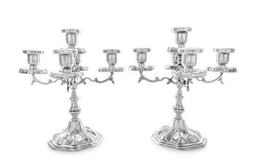 A Pair of Mexican Silver Five-Light Candelabra, Maciel, Mexico City, each having a central urn form candle cup with a lobed d