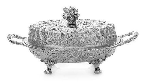 * An American Coin Silver Covered Entree, S. Kirk & Son, Baltimore, MD, of oval, handled form having allover floral decoratio