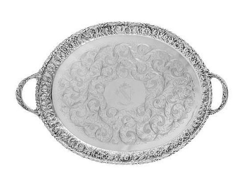 * An American Silver Serving Tray, S. Kirk & Son, Baltimore, MD, the twin-handled tray having a repousse floral and foliate b