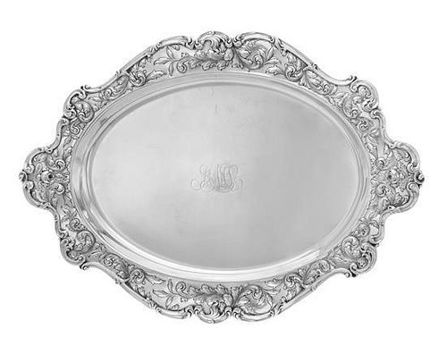 * An American Silver Serving Tray, Gorham Mfg. Co., Providence, RI, 1902, the oval platter with an undulating rim decorated w