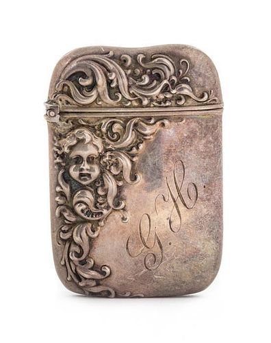 * An American Silver Vesta Case, Possibly John Hasselbring, Brooklyn, NY, the body decorated with repousse foliate volutes an