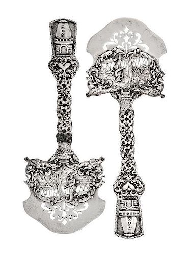 A Pair of American Silver Asparagus Servers, Marshall Field & Co., Chicago, IL, the openwork blade decorated with a hunter an