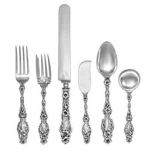* An American Silver Flatware Service, Whiting Mfg. Co., New York, NY, Lily pattern, comprising: 12 dinner knives 12 dinner f