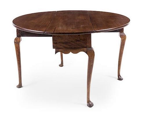 An American Queen Anne Walnut Drop-Leaf Table Height 29 x width 48 x depth 17 inches (closed).