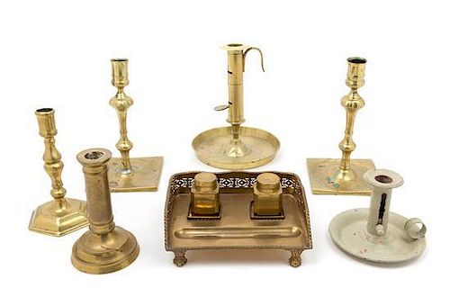 A Collection of Brass Candlesticks Height of tallest 8 1/2 inches.