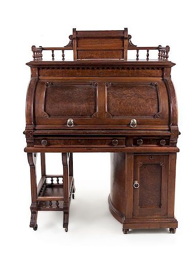 A Wooton Patent Walnut Rotary Desk Height 63 5/8 x width 45 1/2 x depth 29 3/8 inches.