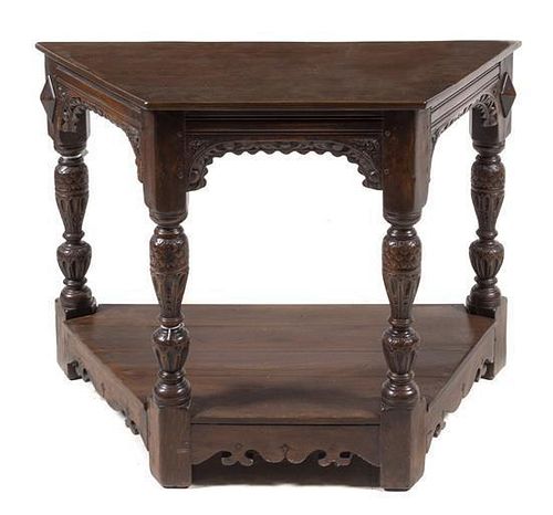 A Jacobean Style Carved Table Height 32 x width 45 x depth 28 inches.