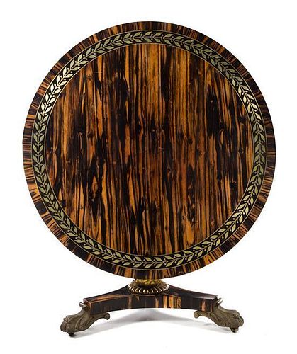 A Regency Brass Inlaid Calamander Center Table Height 29 1/4 x diameter of top 47 1/2 inches.