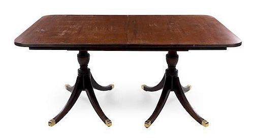 A Regency Style Mahogany Dining Table Height 29 x width 66 x depth 41 inches.