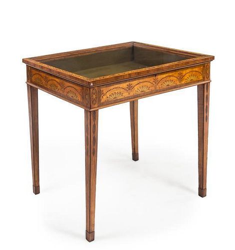A Hepplewhite Style Satinwood, Mahogany and Marquetry Vitrine Table Height 29 1/4 x width 31 x depth 23 inches.