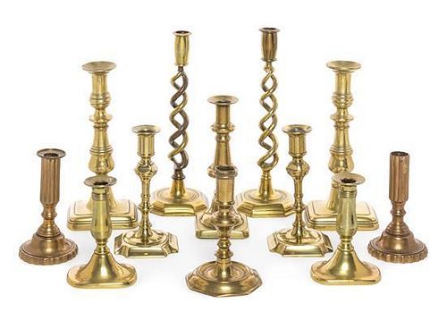 * A Collection of Victorian Brass Candlesticks Height of tallest 11 3/4 inches.
