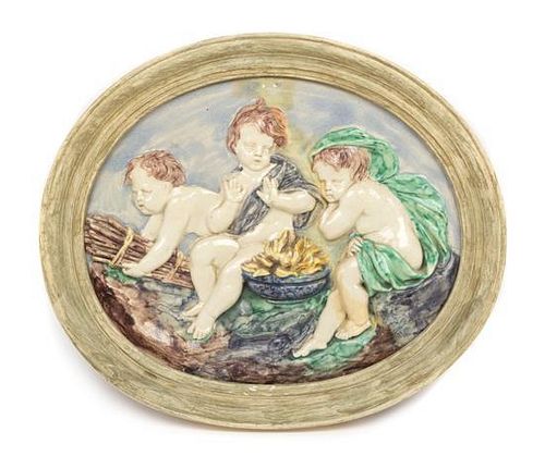 A Pair of Continental Ceramic Allegorical Plaques Width of larger 23 5/8 inches.