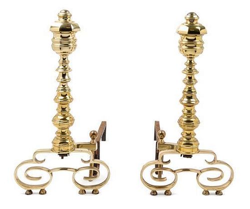 A Pair of Brass Andirons and an Associated Fender Height of andirons 22 1/4 inches.