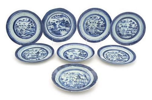 A Group of Eight Canton Blue and White Dinner Plates Diameter of largest 9 inches.