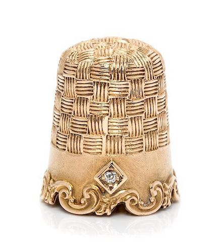 * An American 14-Karat Yellow Gold and Diamond Thimble, Goldsmith, Stern & Co., New York, NY, the top and body with an engine
