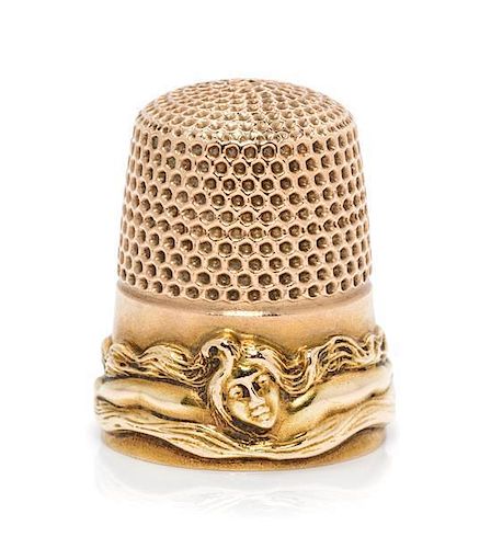 * An American 14-Karat Gold Femme Fleur Thimble, Goldsmith, Stern & Co., New York, NY, the knurled top and body above a band