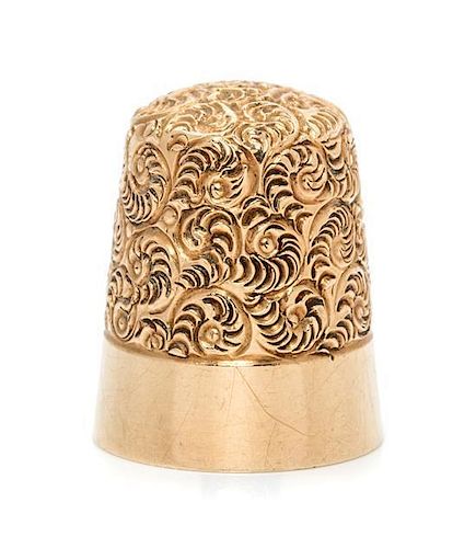 * An American 14-Karat Yellow Gold Thimble, Simons Bros., Philadelphia, PA, the top and body worked to show scrolled decorati