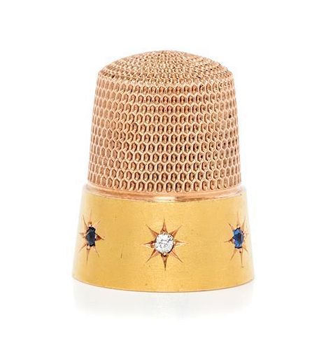 * An American 14-Karat Gold, Diamond and Sapphire Thimble, Simons Bros., Philadelphia, PA, the dimpled top and body above a p