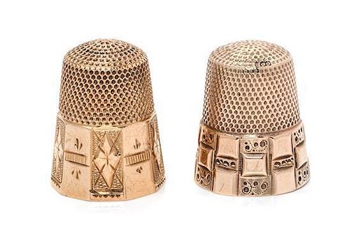 * Two American Gold Thimbles, , each having a knurled top and body above a paneled base, each with foliate and geometric moti