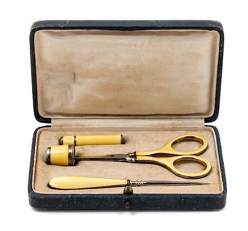 * A German Silver and Guilloche Enamel Four-Piece Sewing Kit, , comprising scissors, a thimble, a stiletto and a needle case,