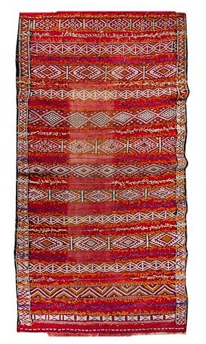* An Afghan Wool Rug 10 feet 1 inch x 5 feet 6 inches.
