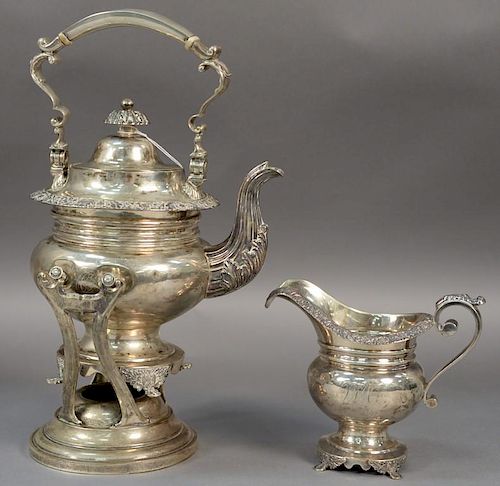 Two piece silver set including a hot water pot on stand and creamer. (creamer handle as is and has small dents, stand may not