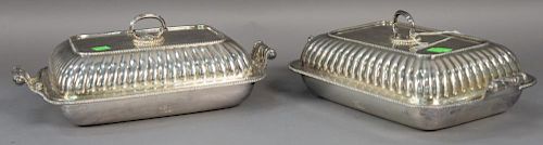 Pair of Sheffield silverplated covered vegetable dishes with coat of arms. 
ht. 5in., lg. 13 1/2in.