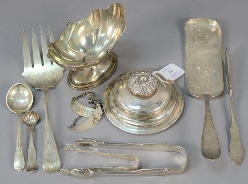 Silver lot including sugar, five serving pieces, two tongs, and one cover. 
19.5 troy ounces