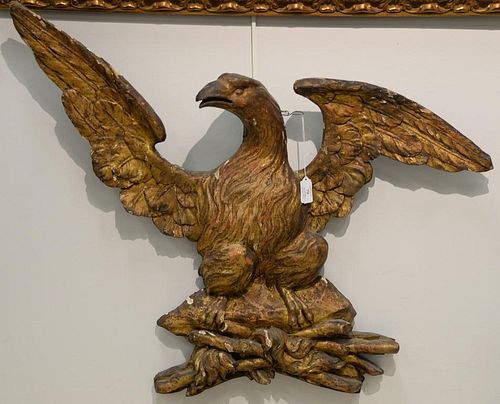 Carved and gilt eagle. 
ht. 28in., wd. 32in.