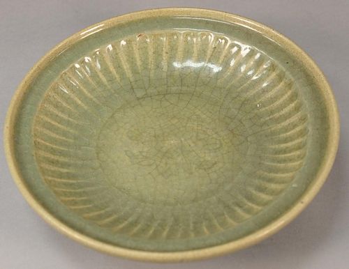 Large Chinese celadon glazed ceramic deep charger with incised flower center.  ht. 3 1/4in., dia. 13 1/4in.